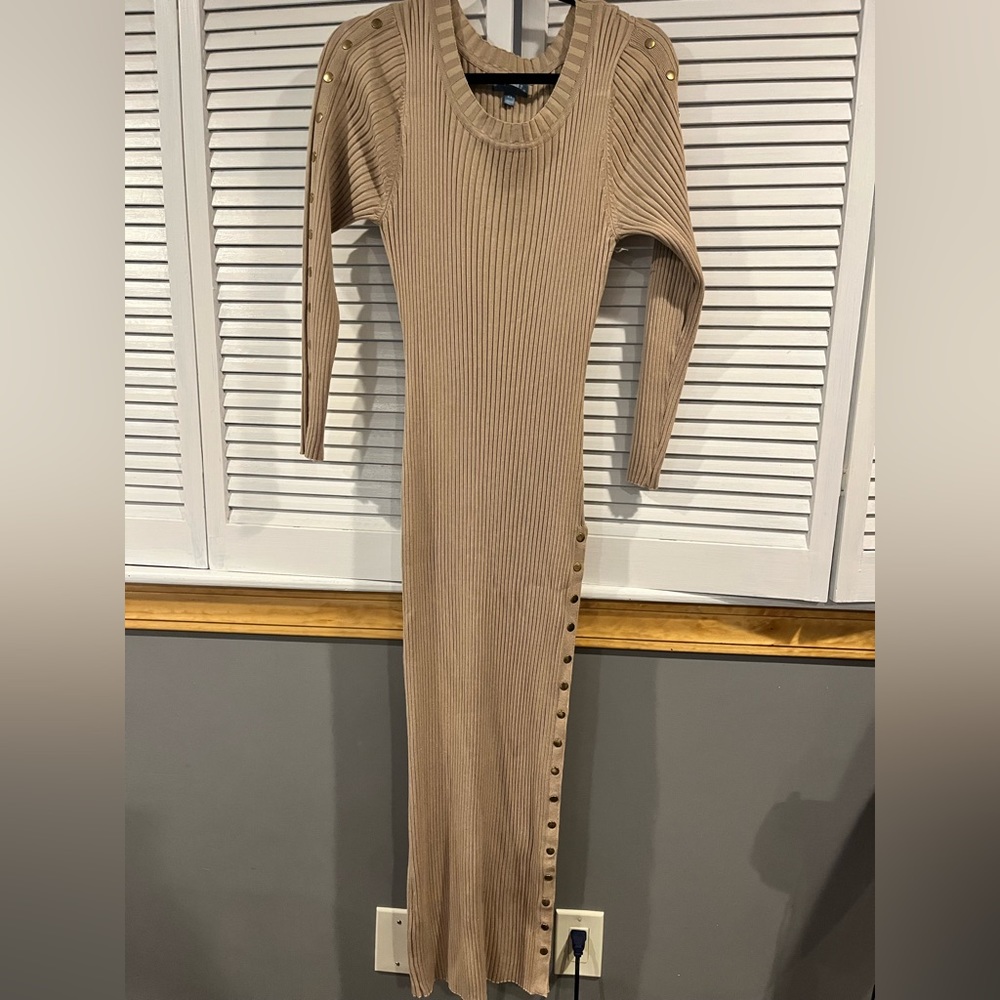 Size 2X. Tan with gold buttons. Buttons unsnap along leg. Great condition.